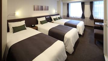 家庭客房 | 羽絨被、書桌、免費 Wi-Fi、床單