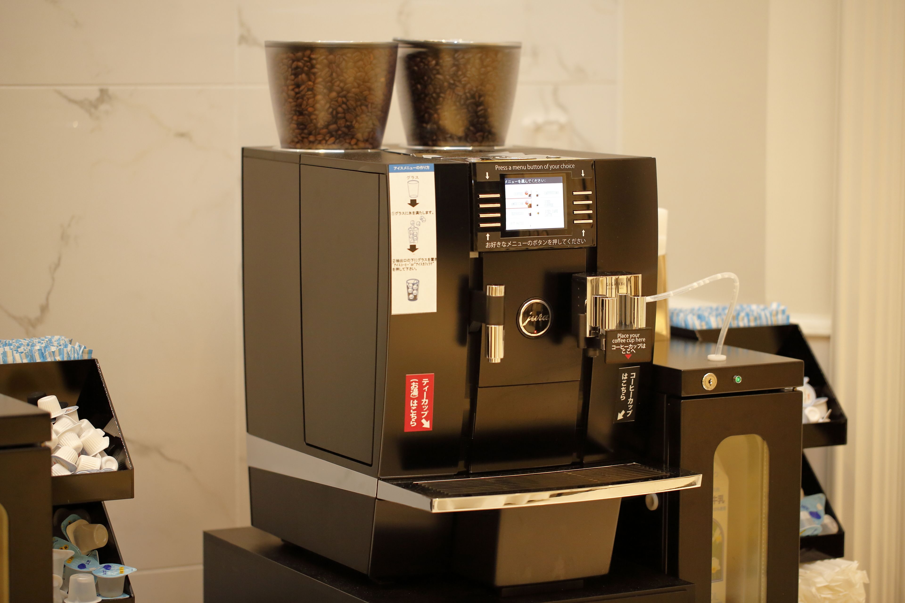 A coffee machine with a digital display and a coffee bean hopper.