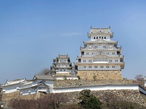 A multi-tiered castle-like structure with traditional architecture, including multiple levels and a stone base. - Hotel Monterey Himeji (Himeji)