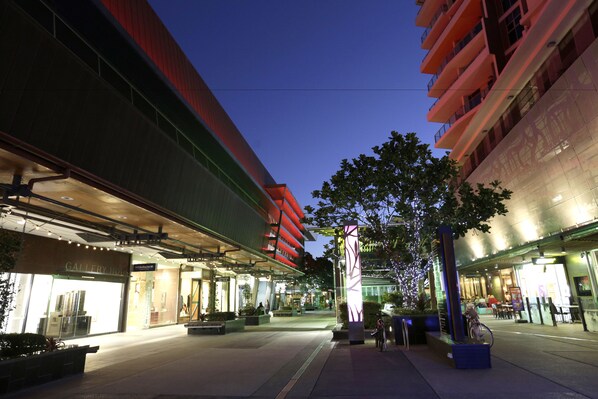 A modern building with a glass facade and a red exterior. - Alcyone Hotel Residences (Hamilton)