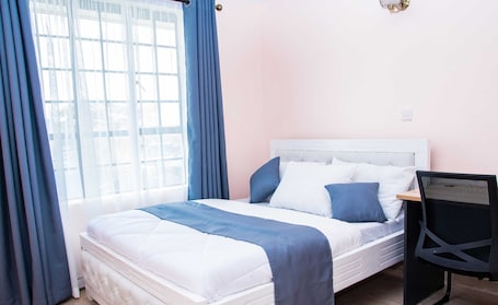 Economy Double Room, 1 Double Bed, Shared Bathroom | In-room safe, iron/ironing board, free WiFi. Karolinas Homestay Near JKIA