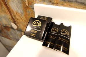 Three black boxes with '216' and 'Evinzin Rahatlgan' text, placed on a white surface. -  216 Eagle Palace Suite (Istanbul)