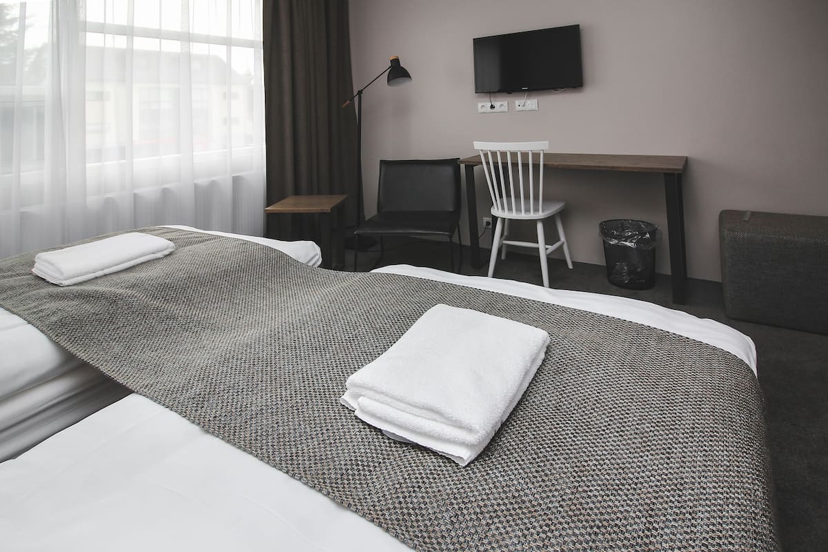 Kamer, 1 twee- of 2 eenpersoonsbedden | 2 slaapkamers, verduisterende gordijnen, geluiddichte muren