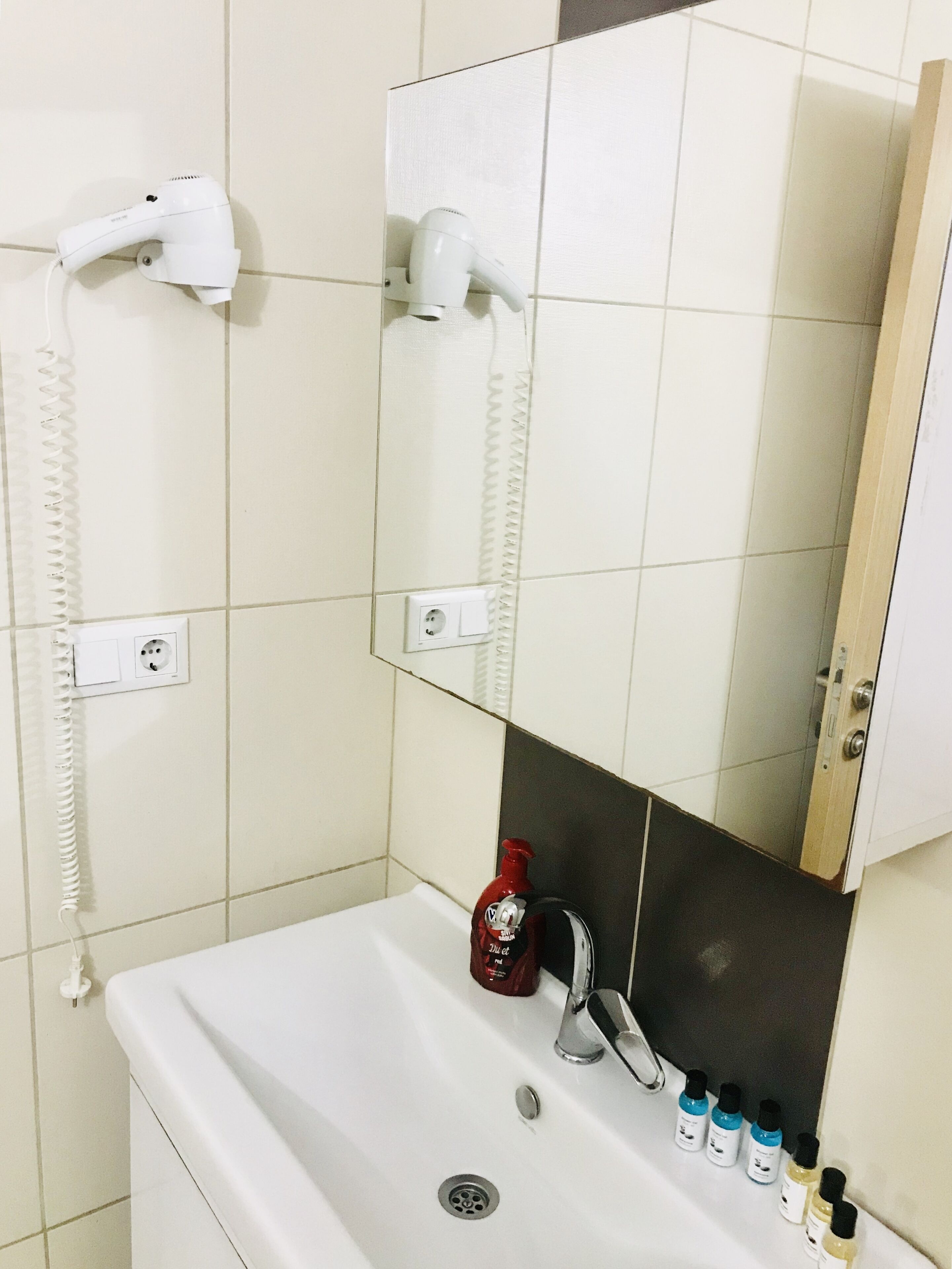 shower, designer toiletries, hair dryer, slippers