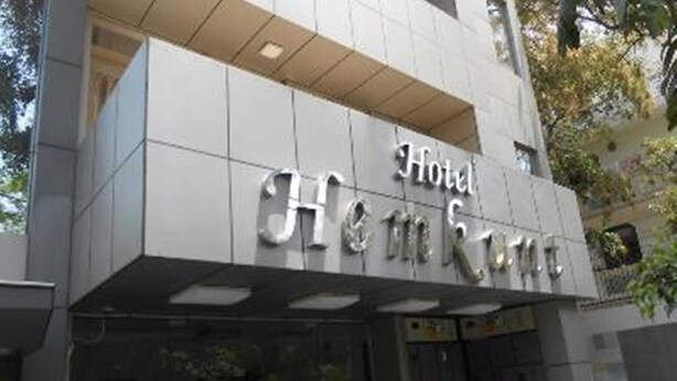 A hotel entrance with a sign that reads "Hotel Hennie & Co." - ZUZU Hemkunt (New Delhi)