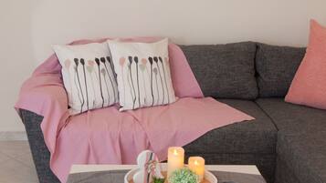 Apartment, 2 Bedrooms (Ortansia) | Living area | Flat-screen TV