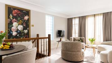 Deluxe appartement, 2 slaapkamers, uitzicht op tuin | Luxe beddengoed, een minibar, een strijkplank/strijkijzer, gratis wifi