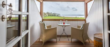 Deluxe Suite, 1 King Bed with Sofa bed, Balcony, Beach View | Terrace/patio