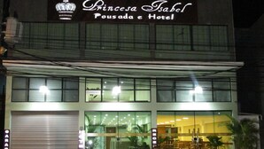 A hotel named 'Princess Isabel Pousada e Hotel' with a visible reception area and a closed garage door. - Princesa Isabel Pousada & Hotel - Rua Teresa (Petrópolis)