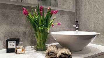 Combined shower/tub, hair dryer, towels, soap