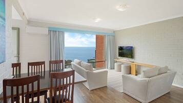 2 Bedroom Apartment | Living area | Flat-screen TV