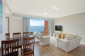 2 Bedroom Apartment | Living area | Flat-screen TV
