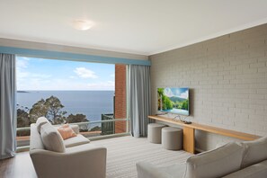 2 Bedroom Apartment | Living area | Flat-screen TV