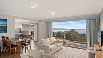 2 Bedroom Apartment | Living area | Flat-screen TV