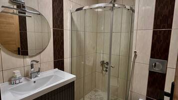 Shower, free toiletries, hair dryer, slippers