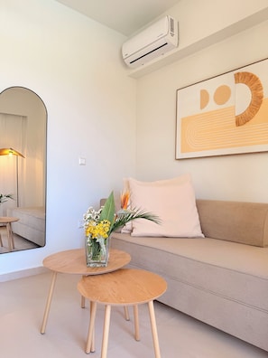 Deluxe Apartment, Partial Sea View | Living area | 43-inch LED TV with digital channels - Almyra Apartments (Rethymno)