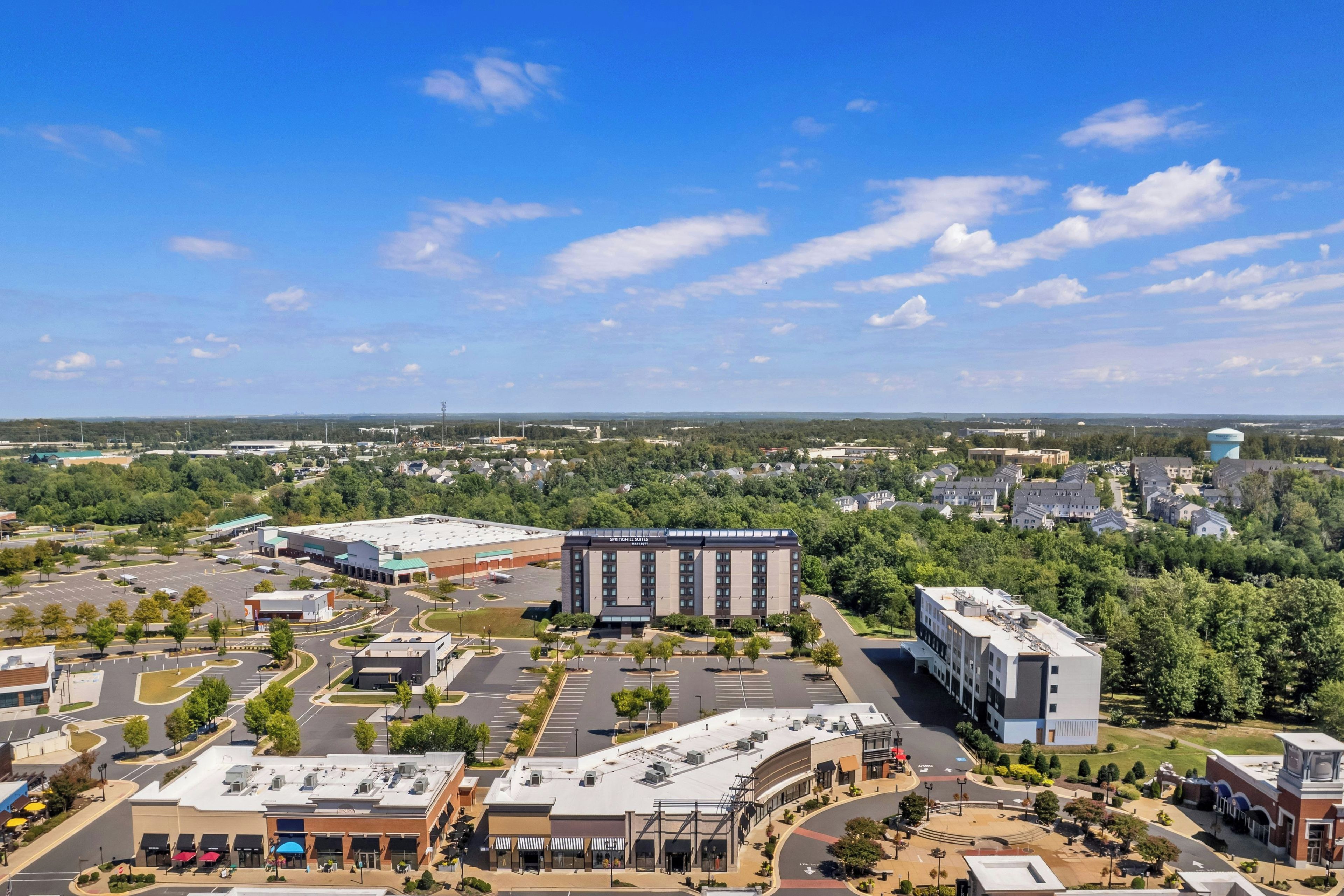 A commercial area with a large building labeled 'Springhill Suites' and a parking lot.