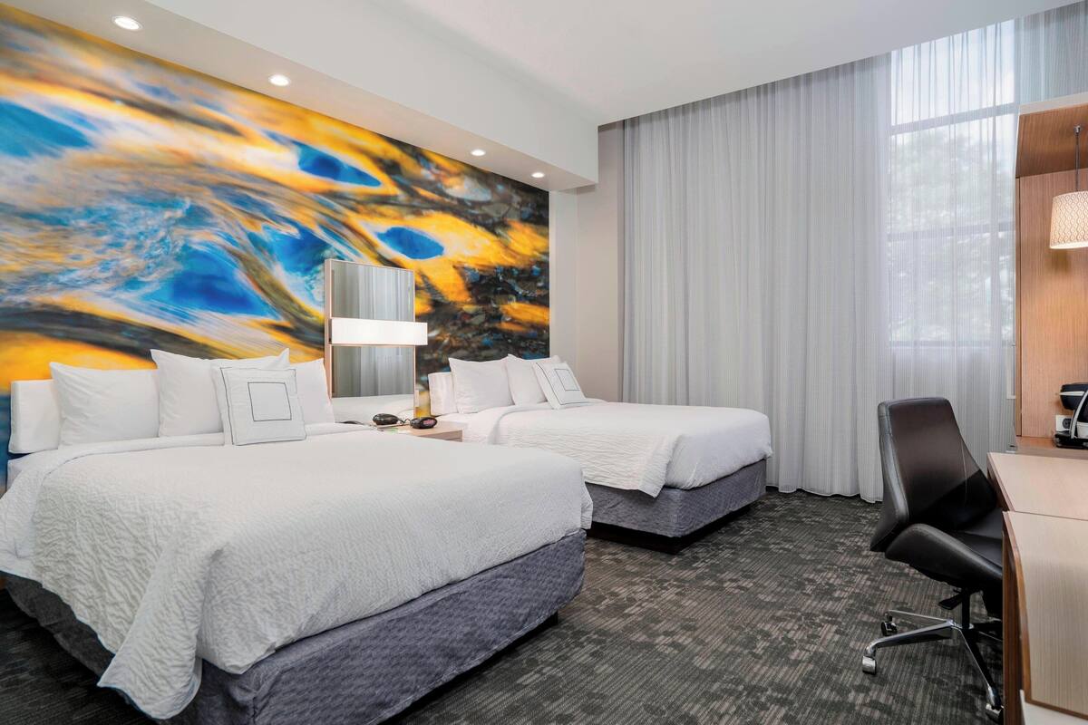 premium bedding, desk, laptop workspace, blackout curtains