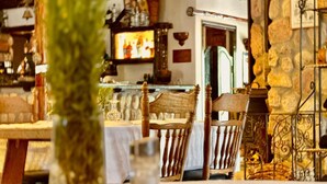 A rustic interior with wooden furniture, stone walls, and a traditional decor style. - La Bergerie (Ouirgane)