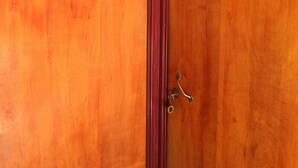 A wooden door with the numbers 1 and 2, indicating a room or apartment number. - Hostal Vilama (San Pedro de Atacama)