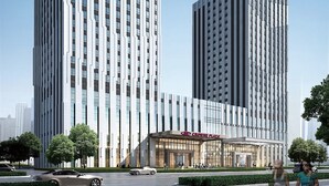 A modern high-rise building with a prominent "Crowne Plaza" sign at the top. - Crowne Plaza Harbin Songbei by IHG (Harbin)