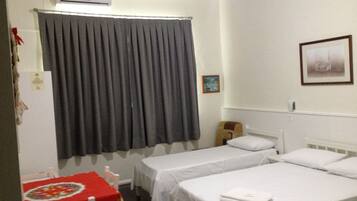 Family Triple Room | Minibar, desk, laptop workspace, blackout drapes