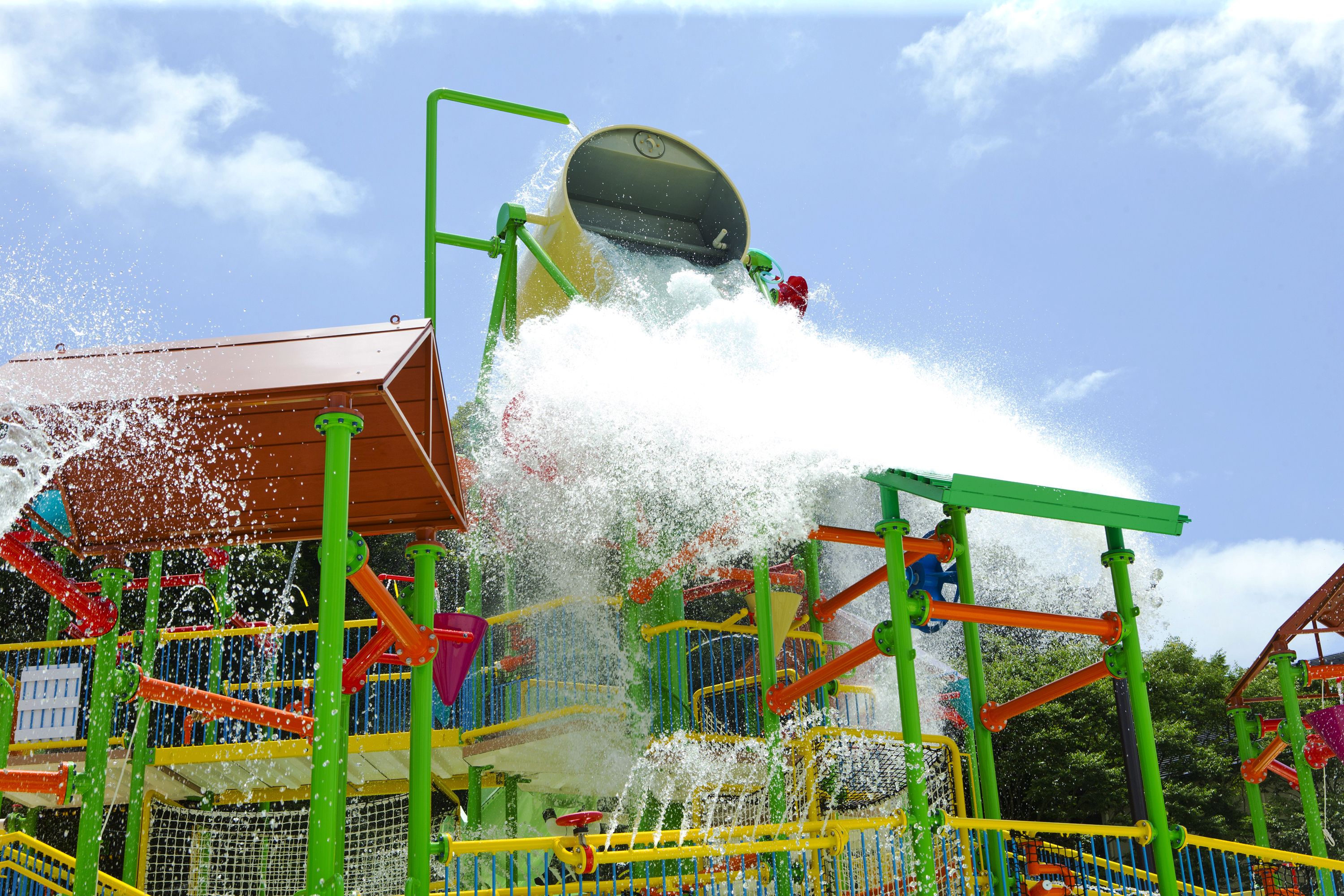 A water play area with multiple levels and colorful structures.