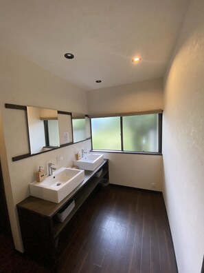 Shower, hair dryer, slippers, towels