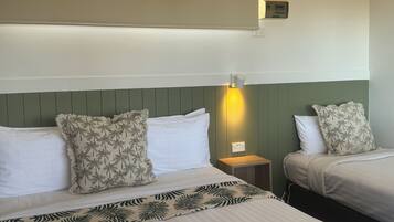 Standard Family Room | Premium bedding, iron/ironing board, free WiFi, bed sheets