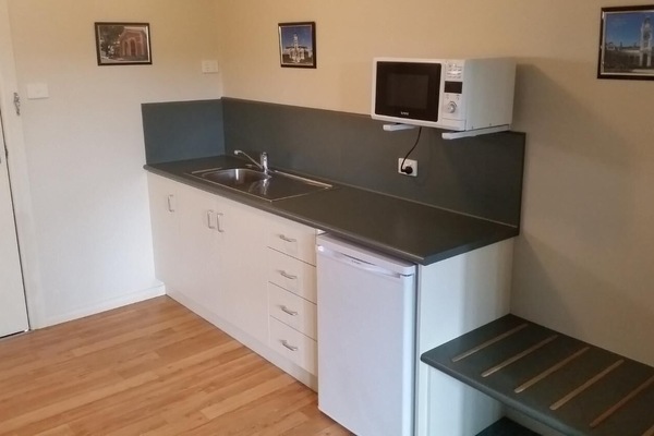 Fridge, microwave, electric kettle, cookware/dishes/utensils