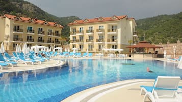 Seasonal outdoor pool, open 10:00 AM to 6:00 PM, pool umbrellas