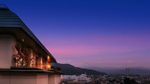 A building with a sloped roof and a balcony with plants. - Kaminoyama Azumaya (Kaminoyama)