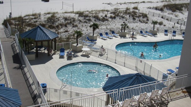 A resort with two swimming pools, beach access, lounge chairs, and a gazebo. - Beautiful White Sand Gulf Beaches-Orange Beach, Alabama (Orange Beach)