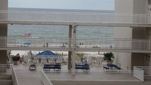 A multi-level outdoor area with seating and a view of the ocean. - Beautiful White Sand Gulf Beaches-Orange Beach, Alabama (Orange Beach)