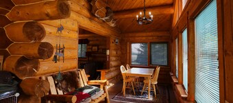 Unique Alaskan log home in trees & wild flowers on 14-acre private homestead.