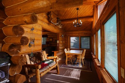 Unique Alaskan log home in trees & wild flowers on 14-acre private homestead.