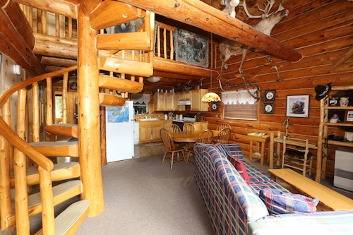 Unique Alaskan log home in trees & wild flowers on 14-acre private homestead.