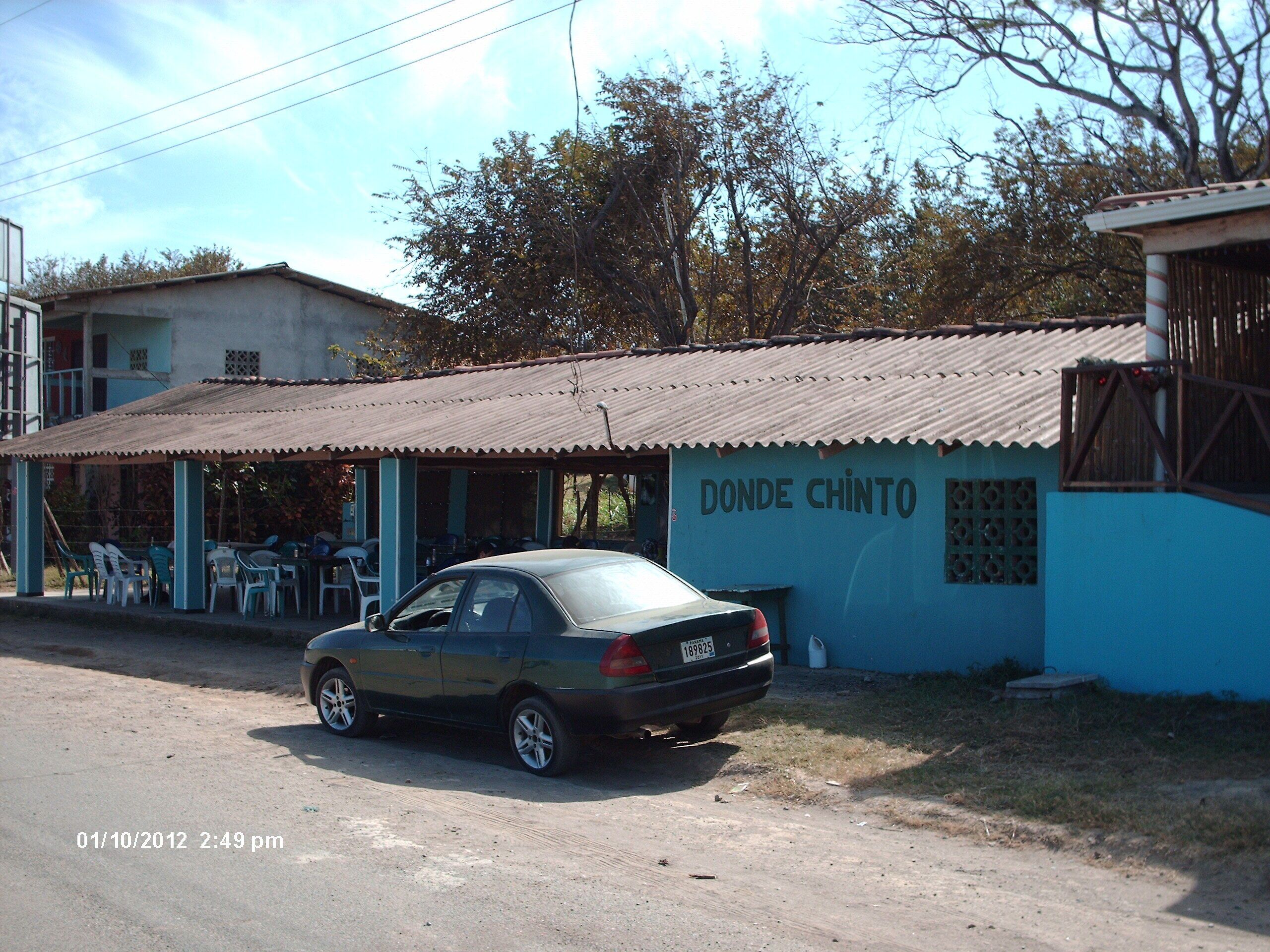 A small building with a corrugated metal roof and a sign reading "DONDE CHINTO".