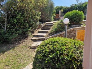 Stroll up the winding stone staircase through the lush garden to a serene haven.