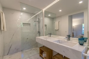 Shower, hair dryer, towels, soap