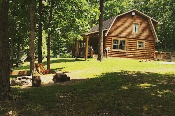 Front yard with fire pit & swing