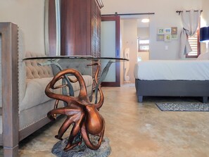 You'll lounge comfortably on this full size sofa with octopus side table.