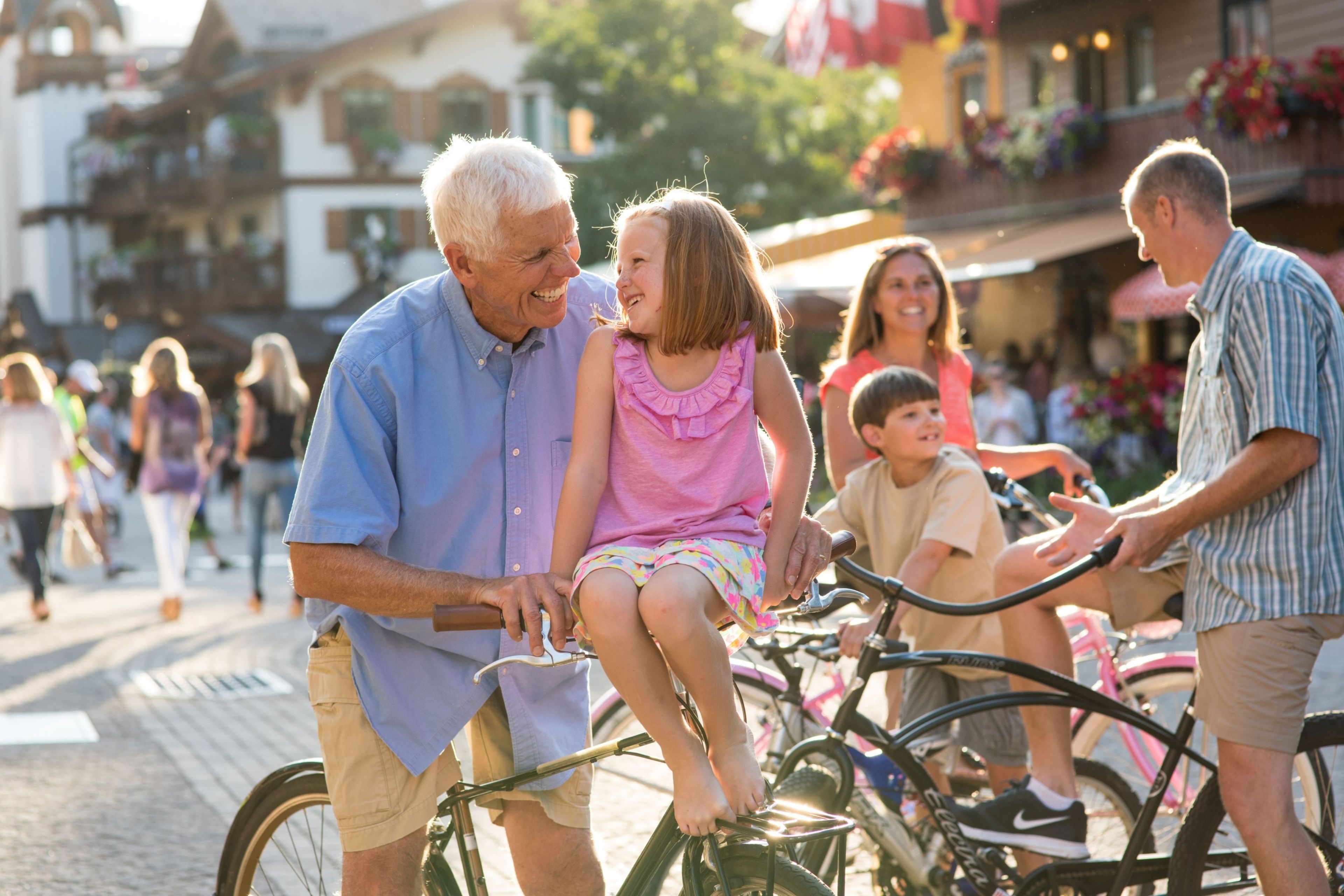 A cobblestone street with people and bicycles.