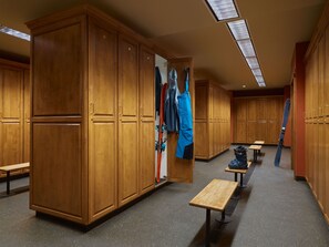 A locker room with wooden lockers, benches, and a ceiling with skylights. - Landmark 208 - 3 Bedroom Platinum (Vail)