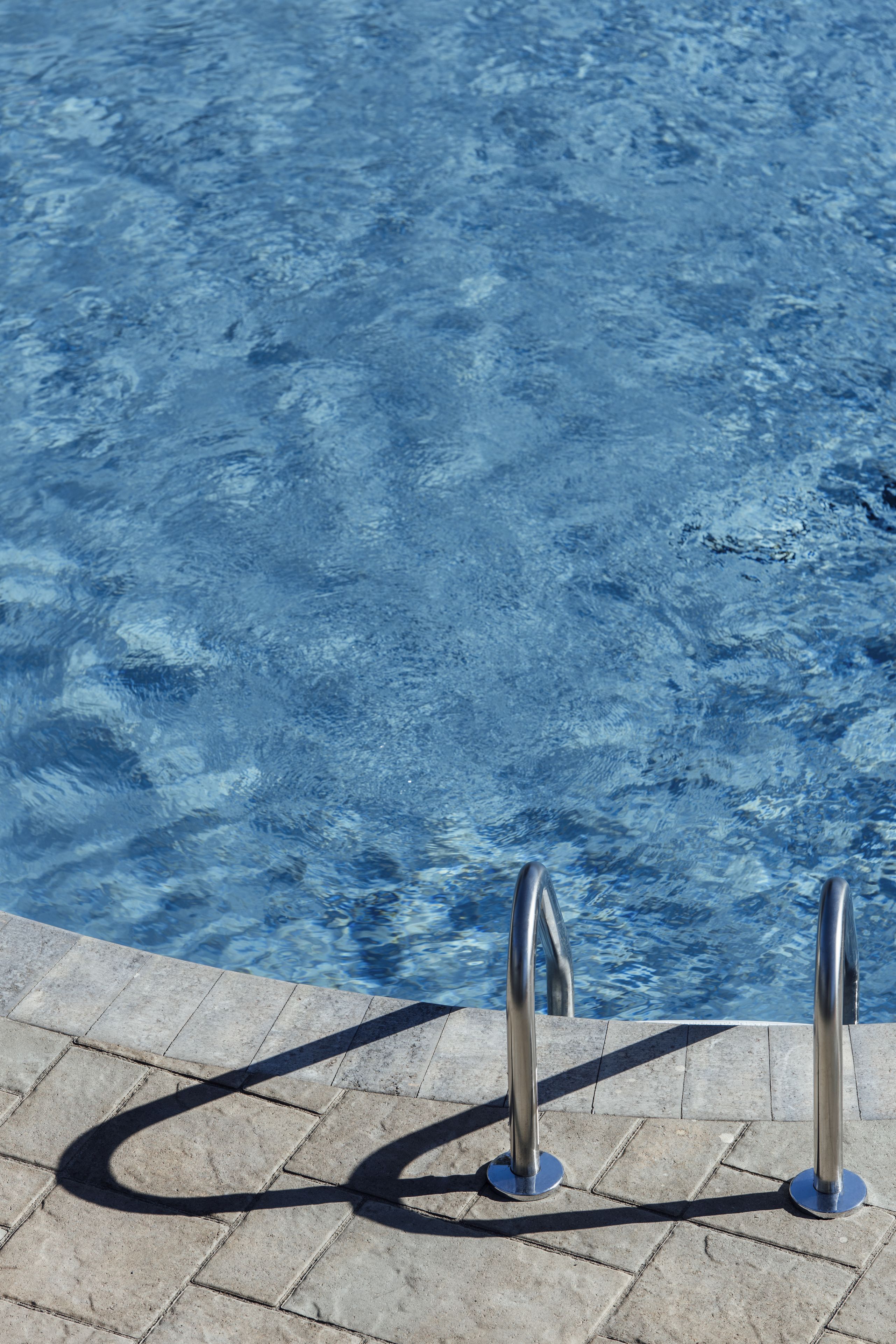 seasonal outdoor pool, pool umbrellas, pool loungers