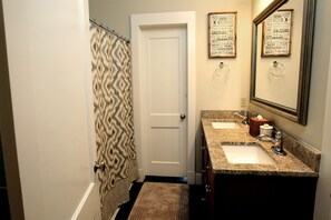 Combined shower/tub, hair dryer, towels, soap