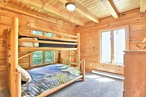 A wooden cabin with a bunk bed, a window, and a door. - Close to hiking, waterfalls & fun! (Clyde)