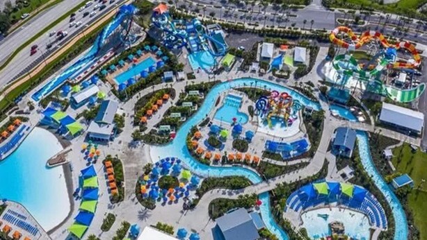 An aerial view of a water park with multiple pools, slides, and wave pools. - 2-306 Legacy Dunes, Close to Disney, Free Wifi and Free Parking (Kissimmee)