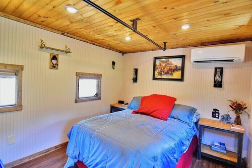 Sleep in a caboose: see bison outside the caboose