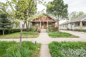 Stunning residential building with a central entrance and beautifully maintained garden.